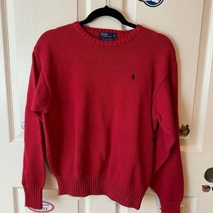 Red polo sweater.